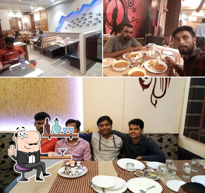 Take a seat at one of the tables at Samruddhi Veg Non Veg Family Restaurant