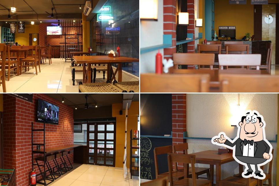 Check out how INFI PIZZERIA WAGHODIA looks inside