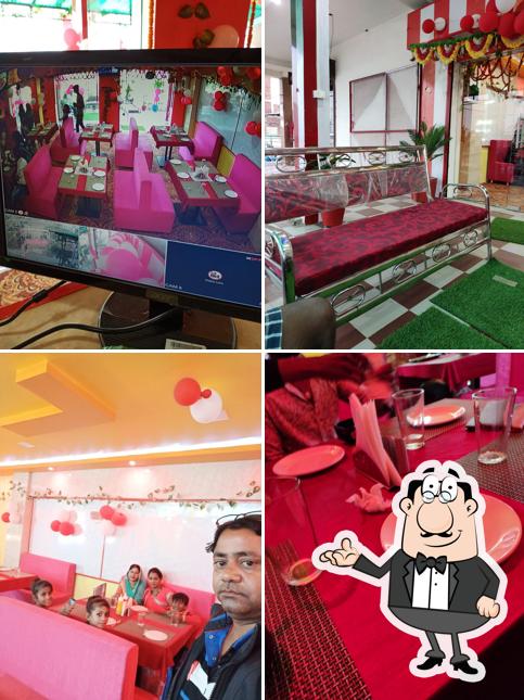 Take a seat at one of the tables at Vrindavan Sweets & Restaurant