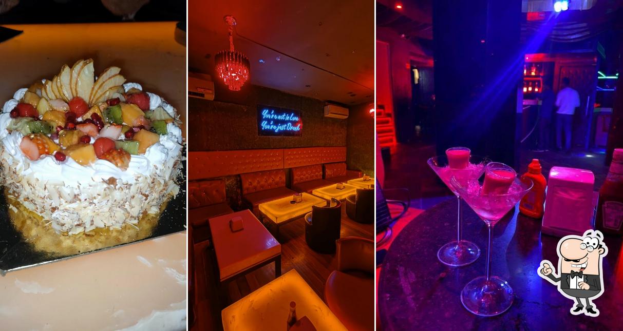 Take a seat at one of the tables at The Red Frog - Bar & Kitchen