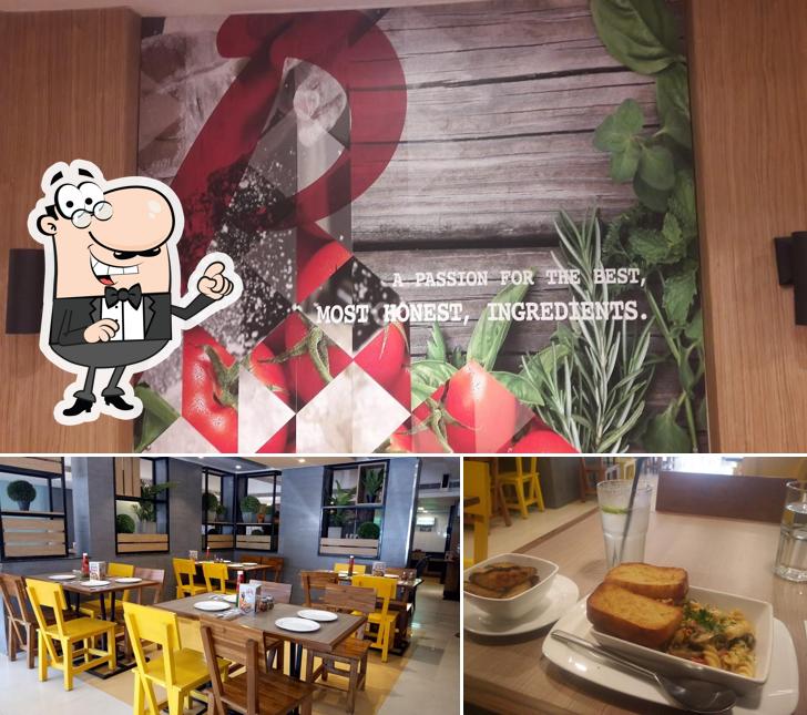 Pizza Hut Galaxy, Vapi is distinguished by interior and dining table