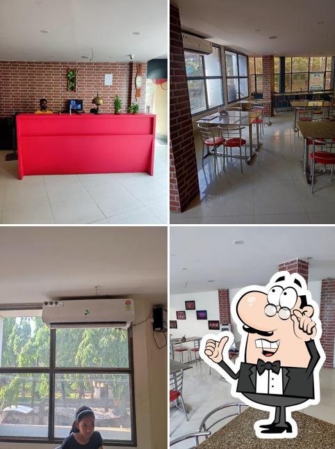 Take a seat at one of the tables at PK Family AC Restaurant