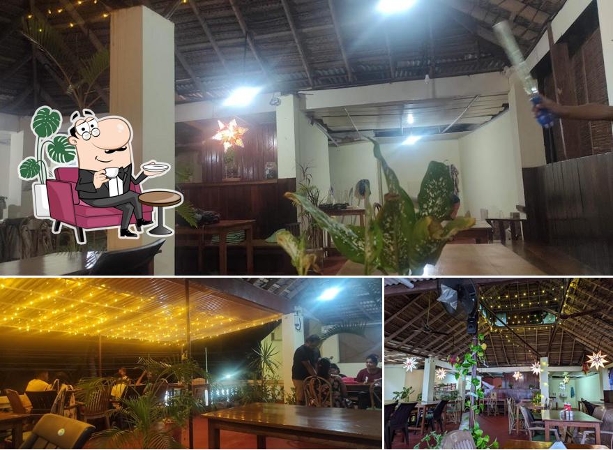 Take a seat at one of the tables at Swiss Cafe