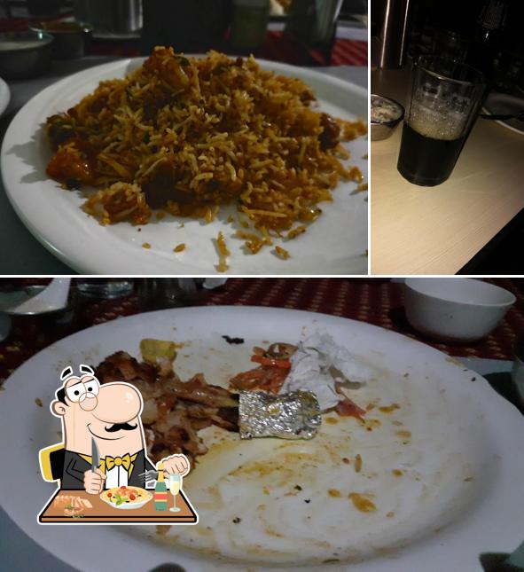 This is the image displaying food and beer at Sri Surya Family Restaurant