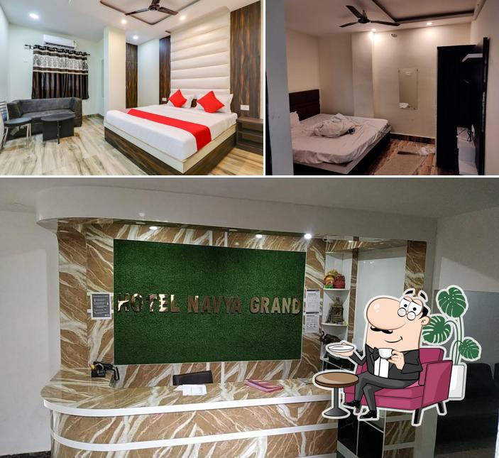 Take a seat at one of the tables at Hotel Navya Grand