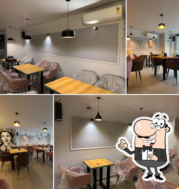 Take a seat at one of the tables at Qissa Cafe