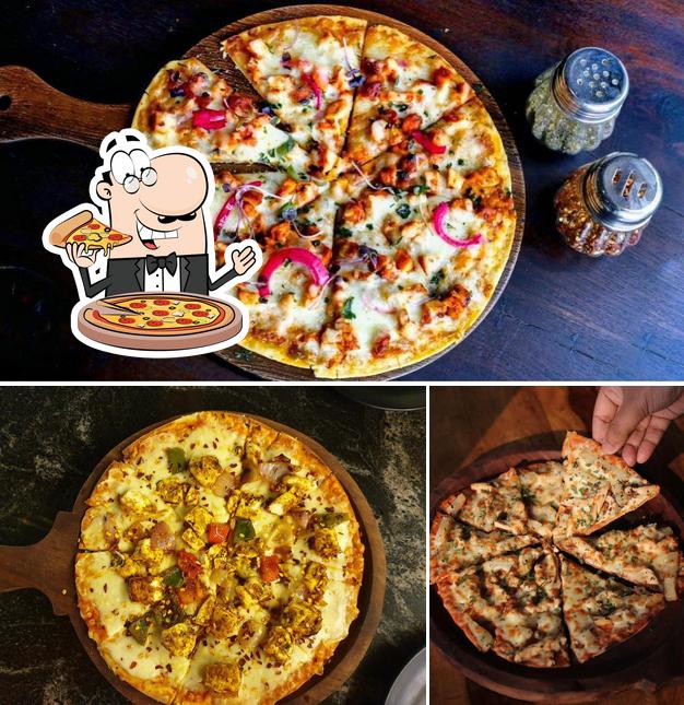 Get pizza at The Aura Cafe & Lounge