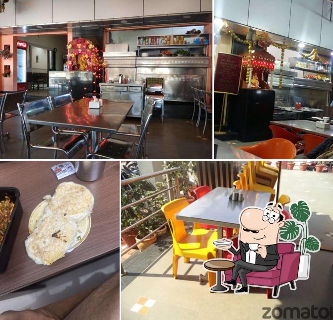 Take a seat at one of the tables at Shivshakti Pure Veg