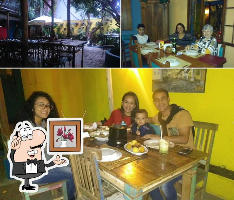 Sente em uma das mesas no Dita Cabrita