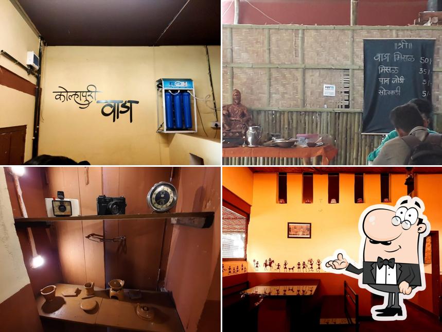 Take a seat at one of the tables at Kolhapuri Wada Misal restaurant