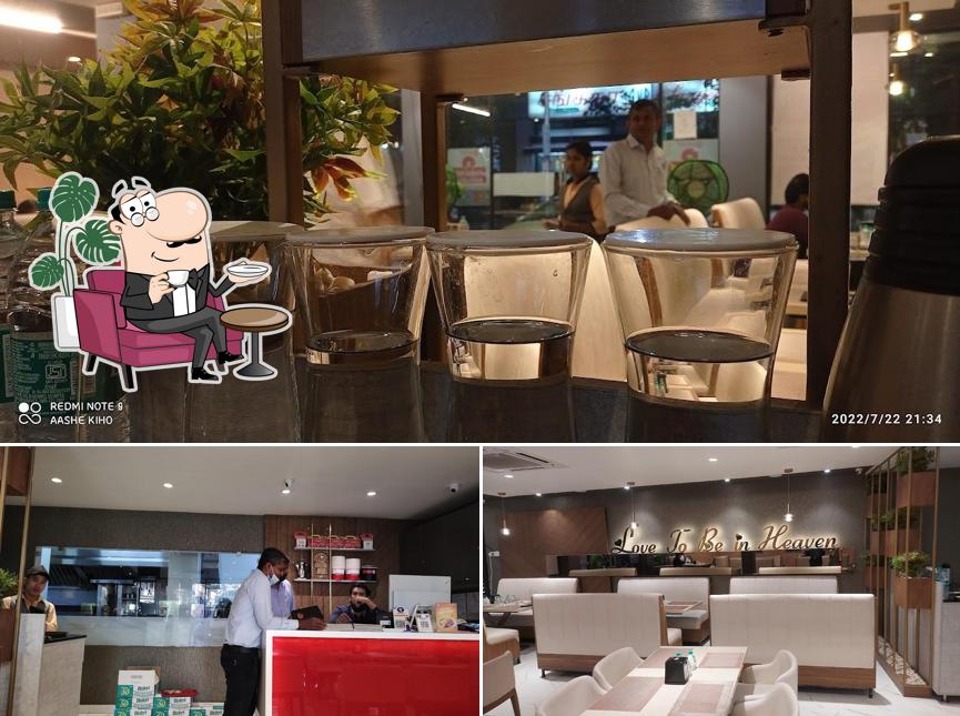 Take a seat at one of the tables at Heaven’s Park Arabian Multi Cuisine Restaurant Chennai