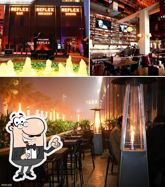 The picture of exterior and dining table at REFLEX - Bar, Brewery & Dining