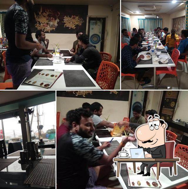 Take a seat at one of the tables at Balaji Family Restaurant (New)