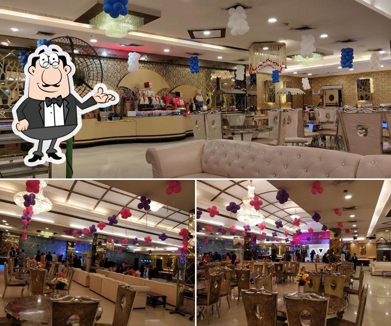 Take a seat at one of the tables at S K Ceremony , Hotel Green Palm