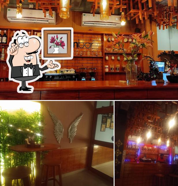 Take a seat at one of the tables at BEANBAR (Cafe & Bistro)