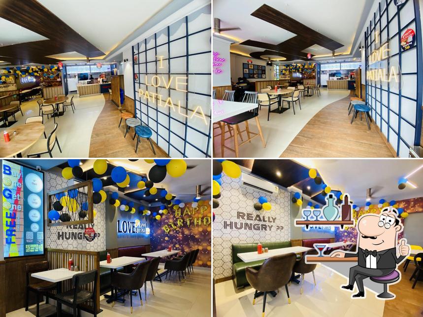 Take a seat at one of the tables at Hungry Point - Tripuri Patiala