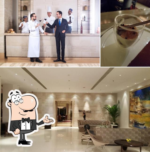 Take a seat at one of the tables at Bella Cucina - Le Meridien Gurgaon, Delhi NCR