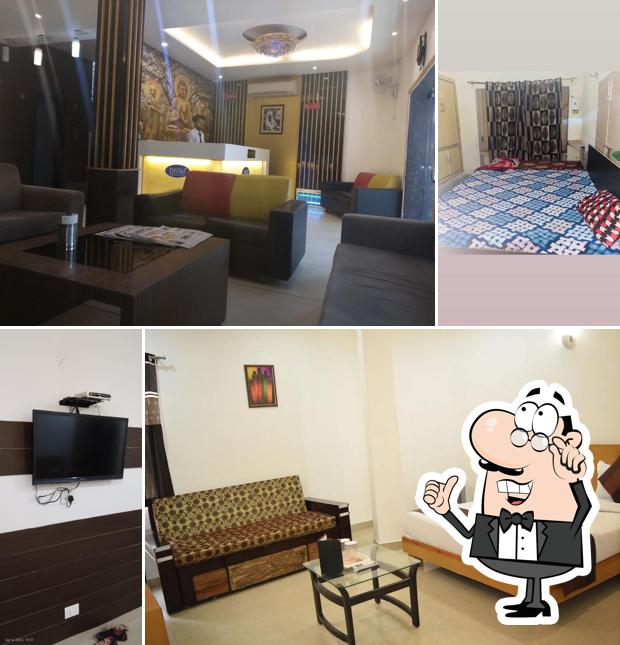 Take a seat at one of the tables at Divud Ecom Hotel