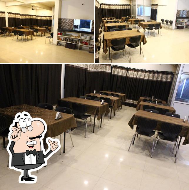 Take a seat at one of the tables at Retreat The Cafe