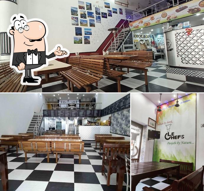 Take a seat at one of the tables at Le Chef - The Restaurant