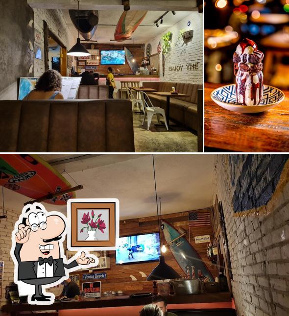 Sente em uma das mesas no Tri Burger