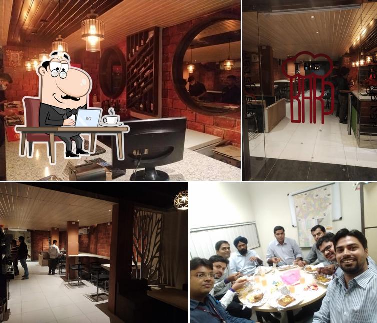 Take a seat at one of the tables at Tapasya Family Restaurant