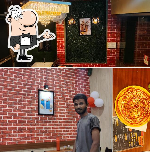 The picture of interior and pizza at La Triangle Slice Pizza