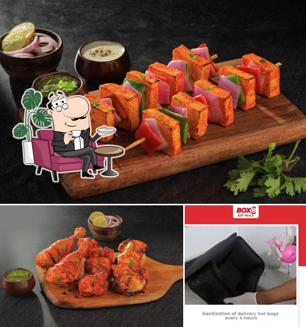 Among different things one can find interior and beverage at BOX8 - Desi Meals