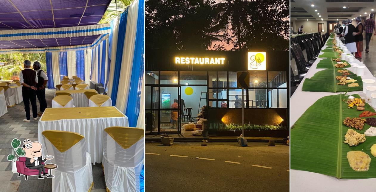 Take a seat at one of the tables at ഊട്ടുപുര റസ്റ്റോറന്റ്