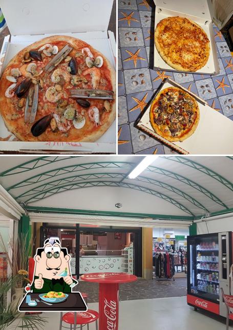 La immagine della cibo e interni di Happy Pizza Caorle