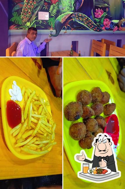 This is the image showing food and interior at SNACKZAA – BEST VEG & NON-VEG RESTAURANT IN ECR / BIRIYAI VIRUNDU / SEAFOOD PLATTER RESTAURANT IN PONDICHERRY
