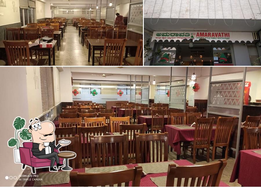 Take a seat at one of the tables at Amaravathi Andhra Style Family Restaurant