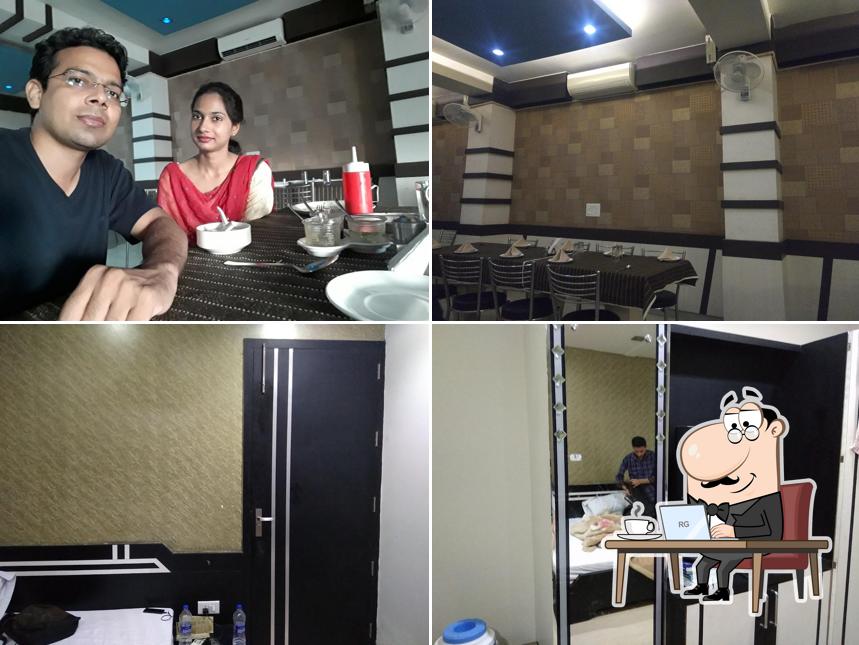 Take a seat at one of the tables at Rajesh Restaurant