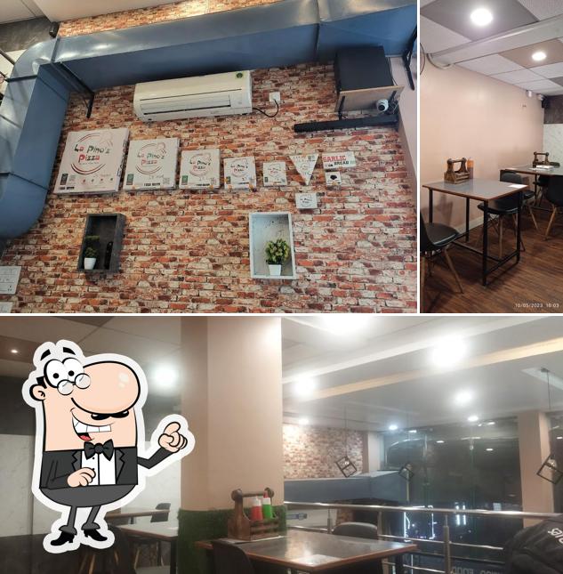 Take a seat at one of the tables at La Pino'z Pizza