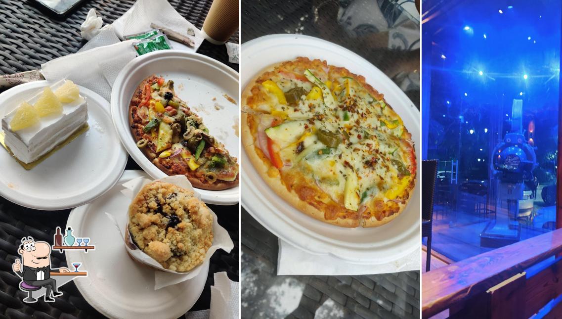 Take a seat at one of the tables at Cine Tree Cafe Best Coffee shop near Connaught place