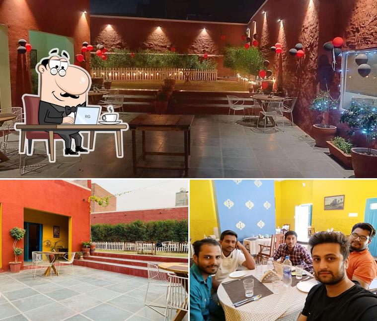 Take a seat at one of the tables at The Old House Pizzeria,Havana cafe