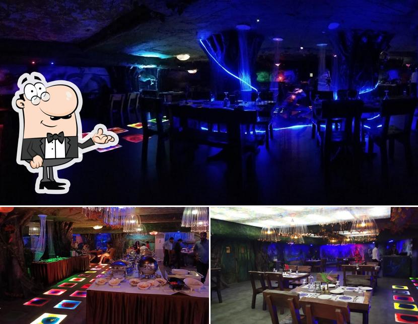 Take a seat at one of the tables at Yazhee World Restaurant