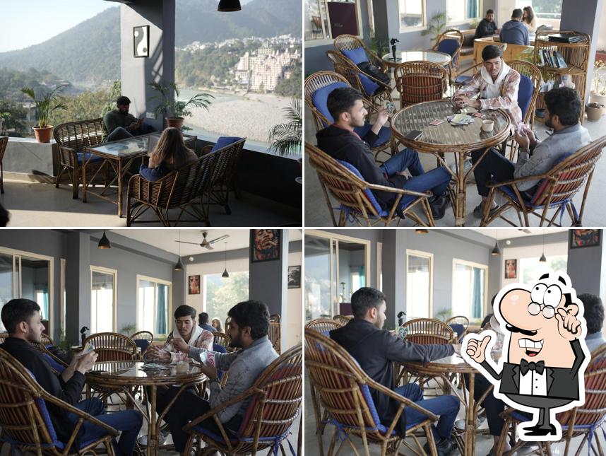 Take a seat at one of the tables at Sky High Cafe Rishikesh (Laxman Jhula)