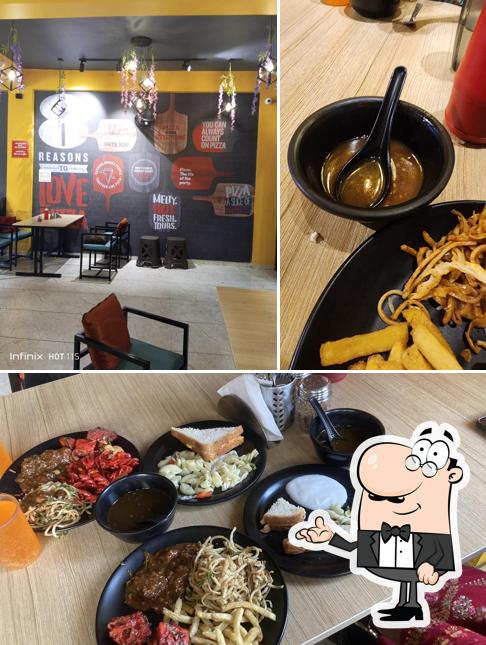 This is the picture displaying interior and food at PIZZA HOME - best family restaurant in kolhapur