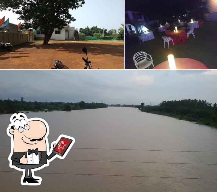 The picture of The RIVER VIEW RESTAURANT’s exterior and dining table