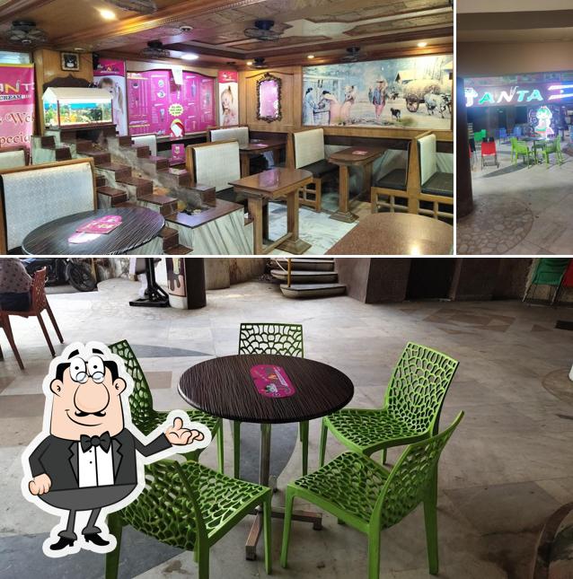 Take a seat at one of the tables at Shree Janta Ice Cream And Juice Parlour