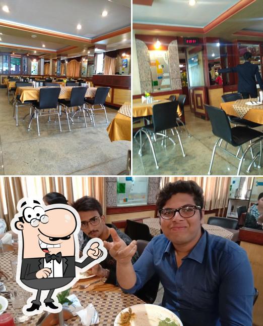 Take a seat at one of the tables at Ponmari Restaurant