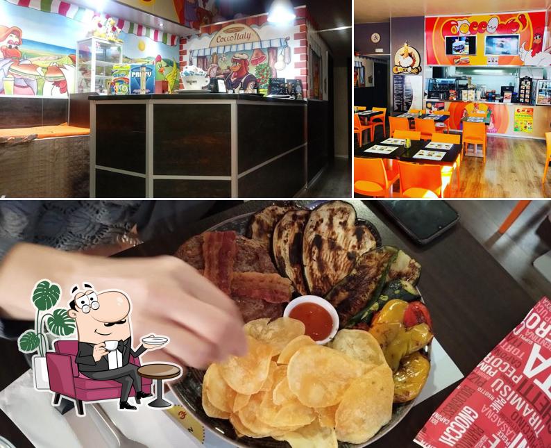 Questa è la foto che presenta la interni e cibo di Coccodè