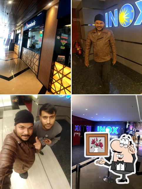 Take a seat at one of the tables at Domino's Pizza