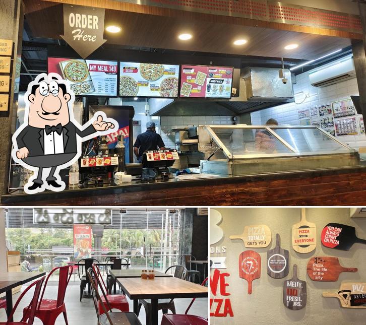Take a look at the image showing interior and beverage at Pizza Hut Toli Chowki, Hyderabad