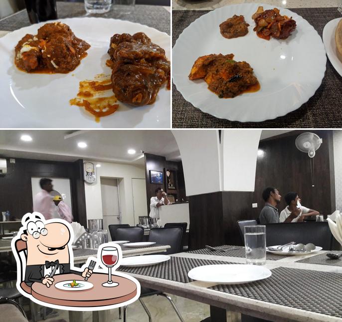 Check out the image displaying food and interior at Konark Restaurant