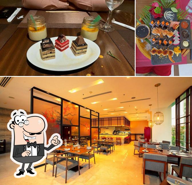 Take a seat at one of the tables at Kuro - The Asian Bistro, Renaissance Ahmedabad