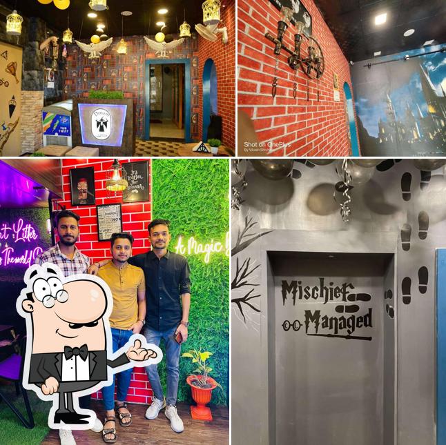 Take a seat at one of the tables at Cafe Dream Arena - Gwalior