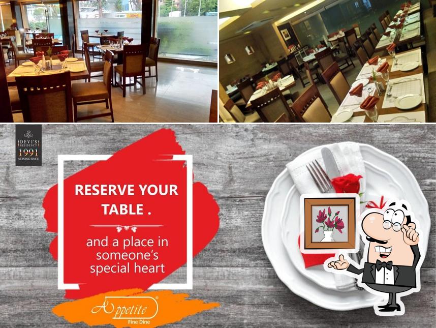 Take a seat at one of the tables at Hotel Devi's Residency