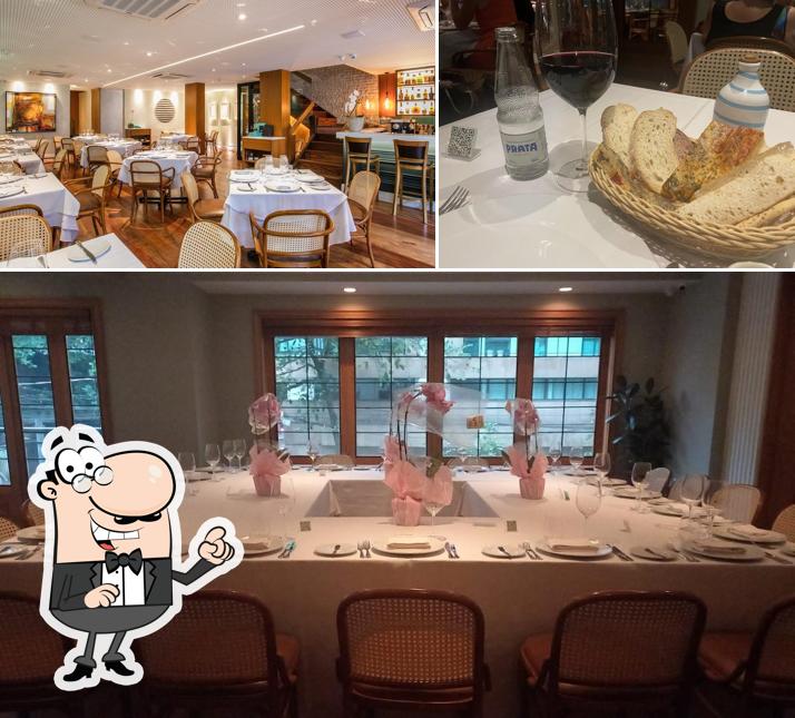 Sente em uma das mesas no Nido Ristorante